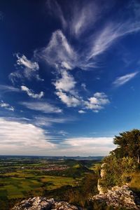 Scenic view of landscape against blue sky