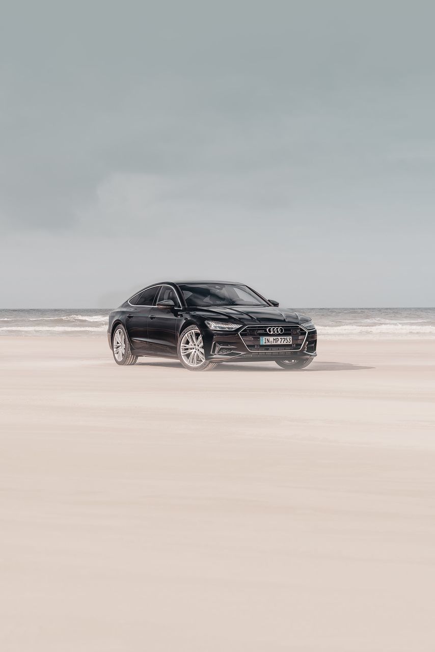 land, sky, beach, water, car, no people, sea, mode of transportation, sand, nature, land vehicle, beauty in nature, scenics - nature, motor vehicle, horizon, transportation, horizon over water, day, copy space, cloud - sky, wheel