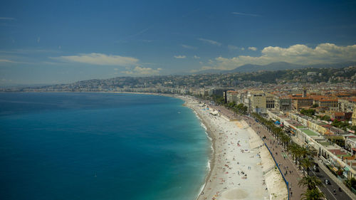 Aerial view of sea against cloudy sky
