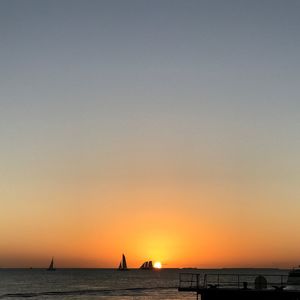 Scenic view of sea against clear sky during sunset