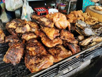 High angle view of meat on barbecue grill