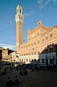 Group of people in front of historical building