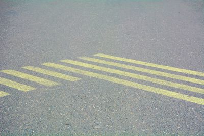 High angle view of yellow road on street