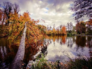 Scenic view of lake against sky during autumn