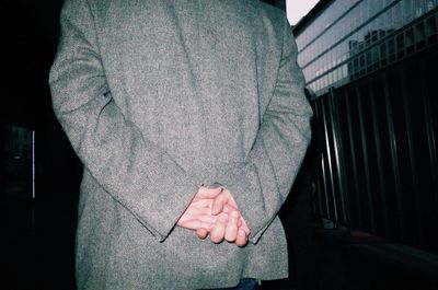 Close-up of man standing on hand