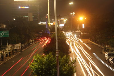 High angle view of light trails on road at night