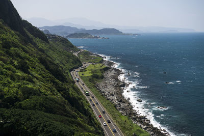 High angle view of road by sea against sky