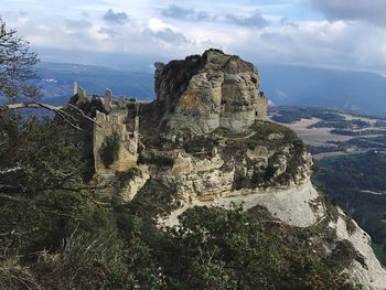 High angle view of rock formation on mountain against sky