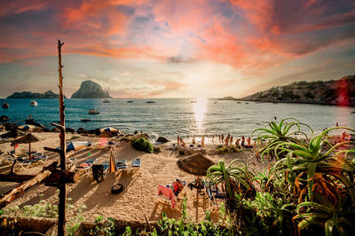 Scenic view of beach against sky during sunset