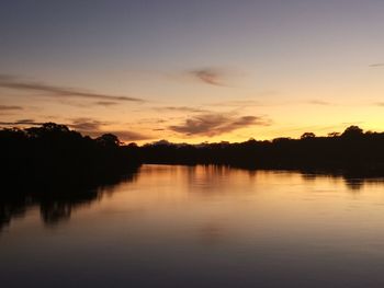 Scenic view of lake against romantic sky at sunset