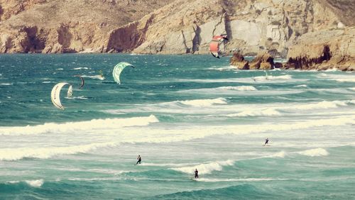 People surfing in sea