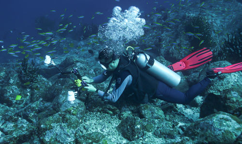 Underwater photographer in action.