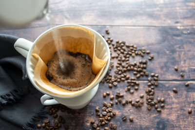 High angle view of coffee cup on table