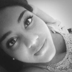 Close-up portrait of a smiling young woman