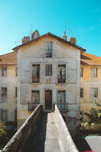 View of old building against clear blue sky