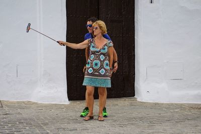 Full length portrait of young woman