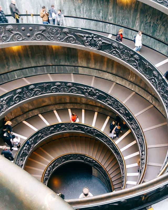 steps, staircase, steps and staircases, architecture, built structure, railing, indoors, high angle view, low angle view, arch, men, spiral staircase, spiral, ceiling, person, escalator, stairs, pattern, lifestyles