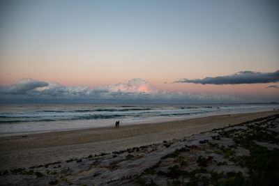 Scenic view of beach against sky during sunset