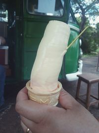 Midsection of person holding ice cream