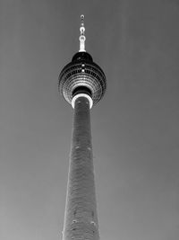 Low angle view of communications tower against sky