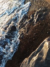 High angle view of waves on beach