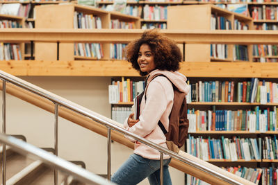 Teenage girl looking away in library