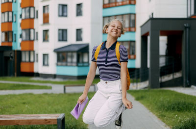 A happy student runs to school, hurries to classes, rejoices in the new academic year. 