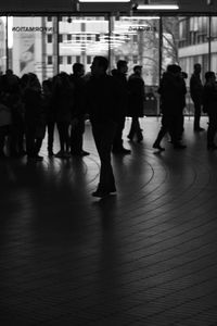 Group of people standing on railroad station platform