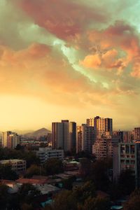 Buildings against sky during sunset