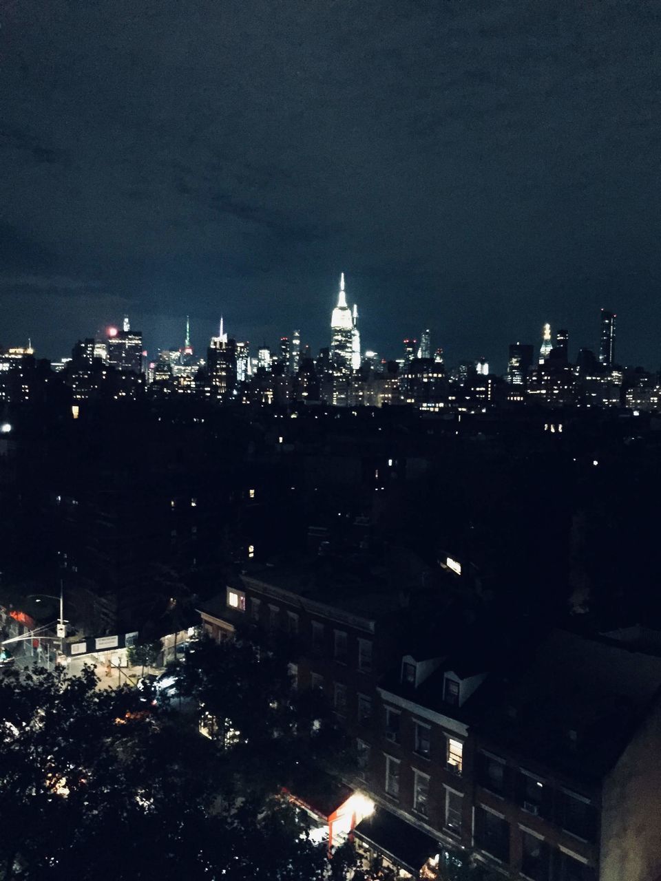 HIGH ANGLE VIEW OF BUILDINGS AT NIGHT