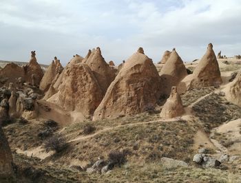 Panoramic view of rocks on landscape against sky