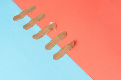 High angle view of information sign on metal against orange background