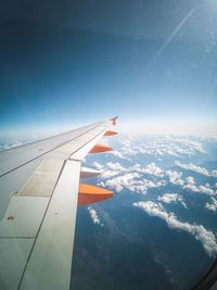 Aerial view of airplane flying in sky