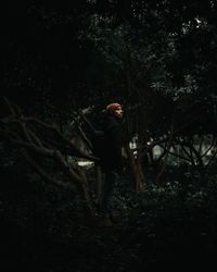 Man standing in forest