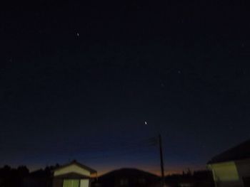 Low angle view of moon against sky at night