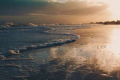 Scenic view of sea against sky at sunset