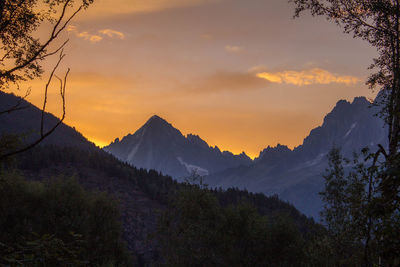 Scenic view of mountains against sky during sunset