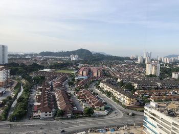 High angle view of street amidst buildings in city