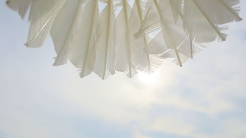 Low angle view of clothes drying against sky