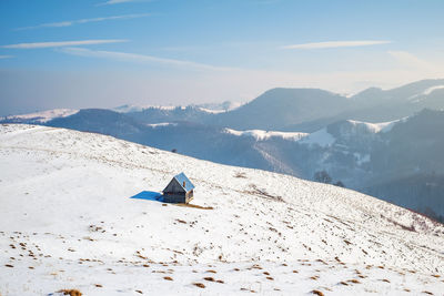 Sun over the winter mountains with snow, cindrel mountains, paltinis, romania
