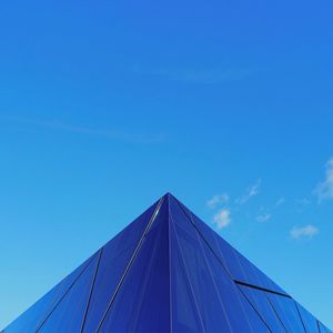 Low angle view of building against blue sky