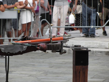 Low section of people standing on table