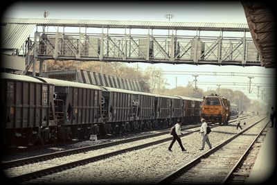 Train at railroad station against sky