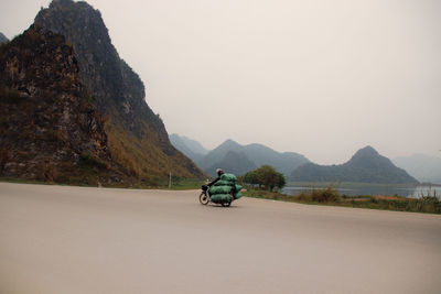Motorbike driver on the road to tam coc, ninh binh vietnam