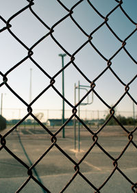 Full frame shot of chainlink fence against sky