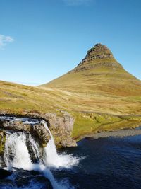 Scenic view of waterfall against clear sky