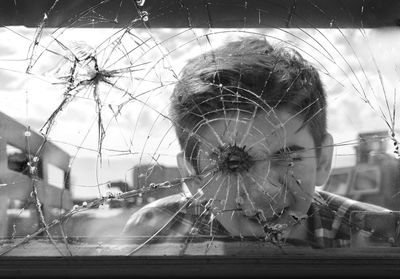 Digital composite image of broken glass window
