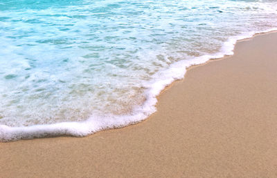 High angle view of waves rushing towards shore