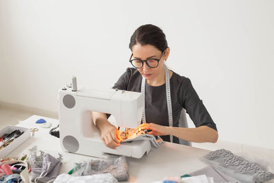 Portrait of woman working on table