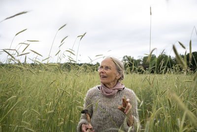 Senior woman walking in field